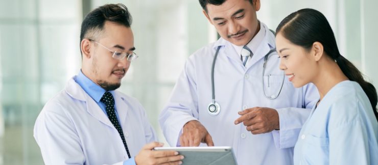doctors-reading-data-digital-tablet